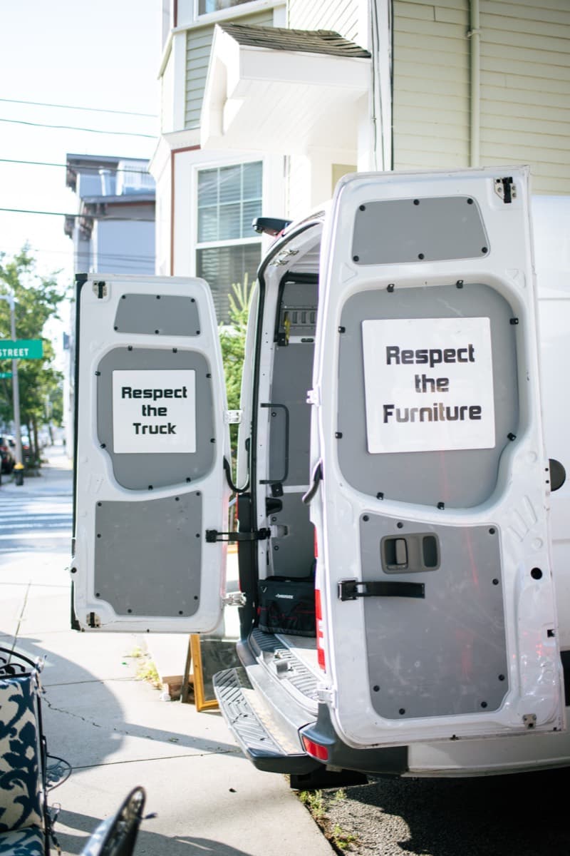 Small Haul cargo van with "Respect the Truck" and "Respect the Furniture" door panels